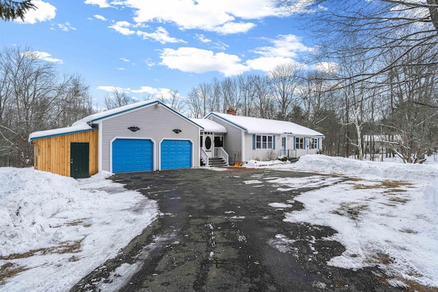 ranch-style house featuring a garage