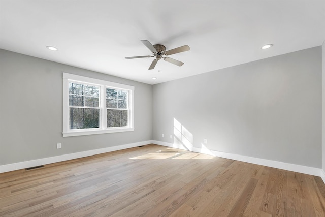 spare room with ceiling fan and light hardwood / wood-style flooring