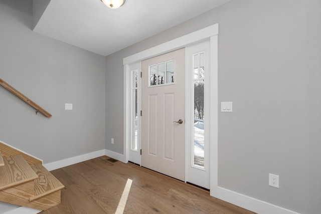 entryway with plenty of natural light and light hardwood / wood-style floors