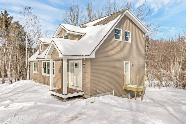 view of snow covered house