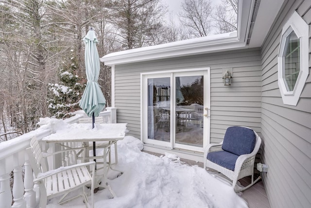 view of snow covered deck