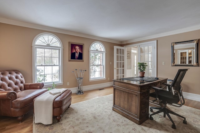 office area featuring crown molding and light wood-type flooring