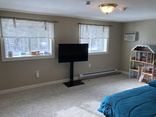 carpeted bedroom with a baseboard heating unit, multiple windows, and baseboards