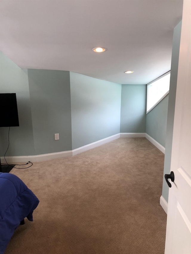 empty room with carpet, baseboards, and recessed lighting