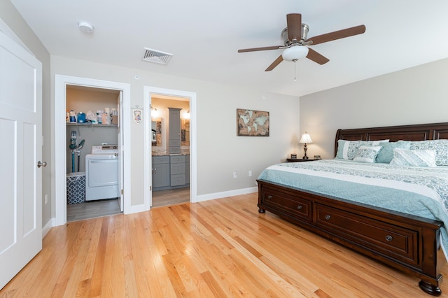 bedroom with ceiling fan, ensuite bath, and light hardwood / wood-style flooring