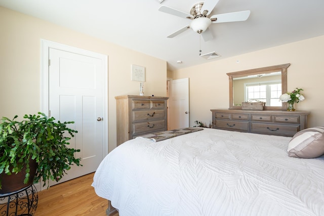 bedroom featuring ceiling fan and light hardwood / wood-style flooring