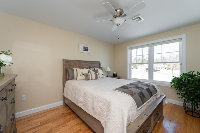 bedroom featuring ceiling fan and light hardwood / wood-style flooring