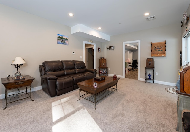 living room featuring light colored carpet