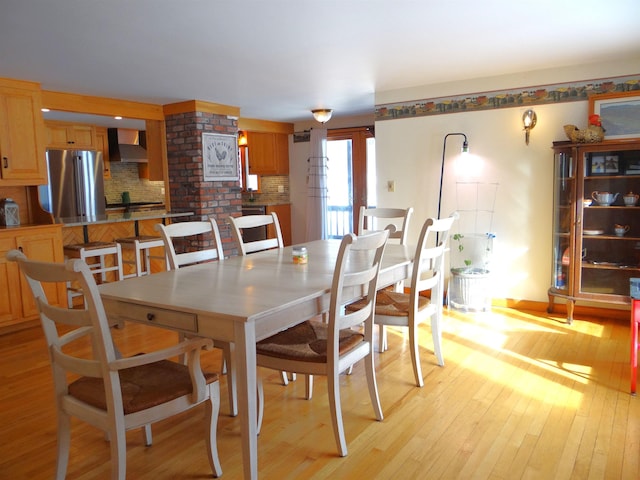 dining space featuring light hardwood / wood-style floors