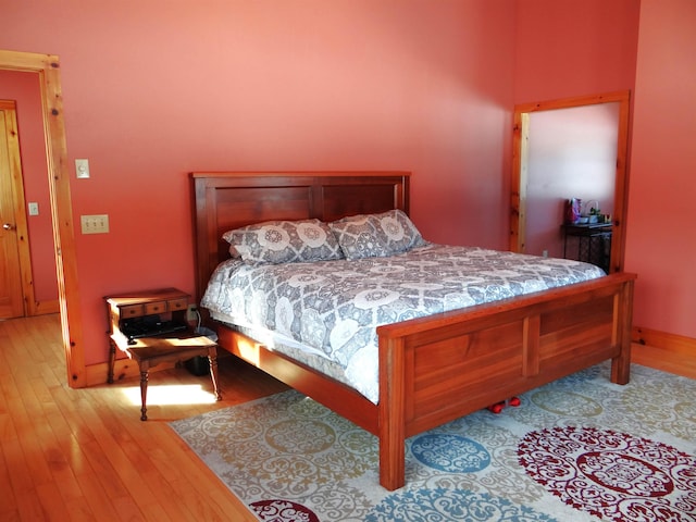 bedroom with light wood-type flooring