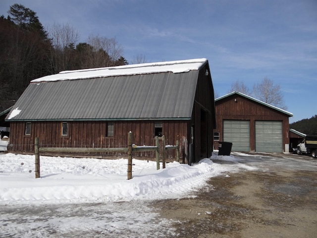 exterior space featuring a garage and an outdoor structure