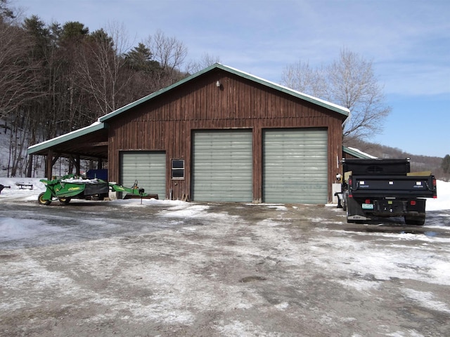 view of snow covered garage