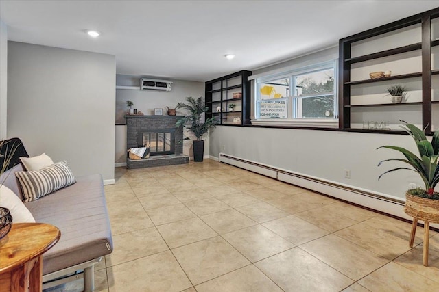 tiled living room featuring a baseboard heating unit, a wall mounted air conditioner, and a brick fireplace