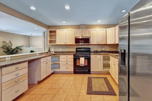 kitchen with light tile patterned flooring and stainless steel appliances