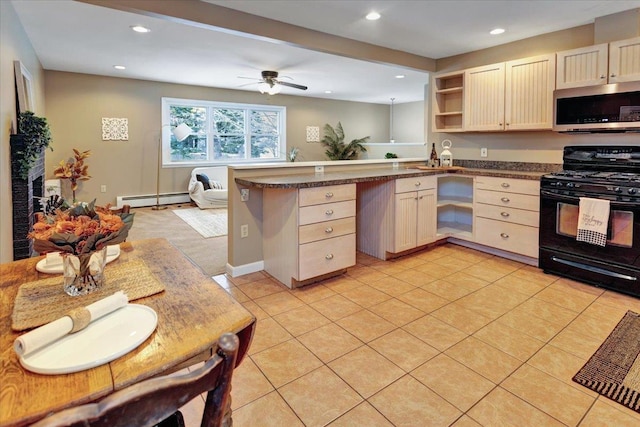 kitchen with gas stove, light tile patterned floors, kitchen peninsula, ceiling fan, and a baseboard heating unit