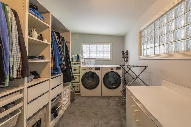 laundry room featuring washing machine and dryer and dark carpet