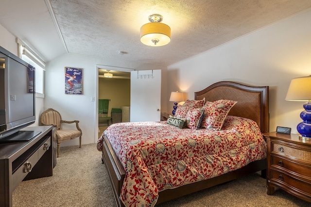 bedroom featuring lofted ceiling, light carpet, and a textured ceiling