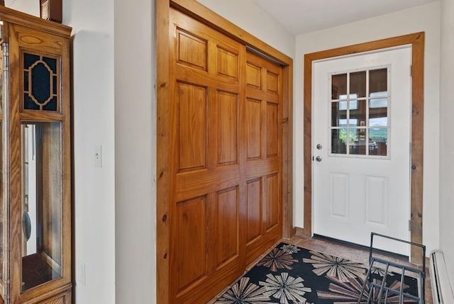 entryway featuring a baseboard heating unit