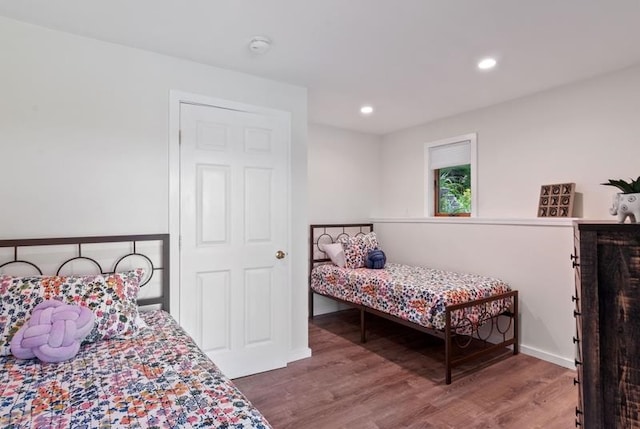 bedroom with hardwood / wood-style flooring