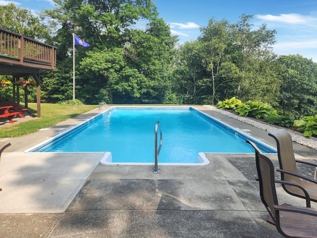 view of pool with a deck and a patio area