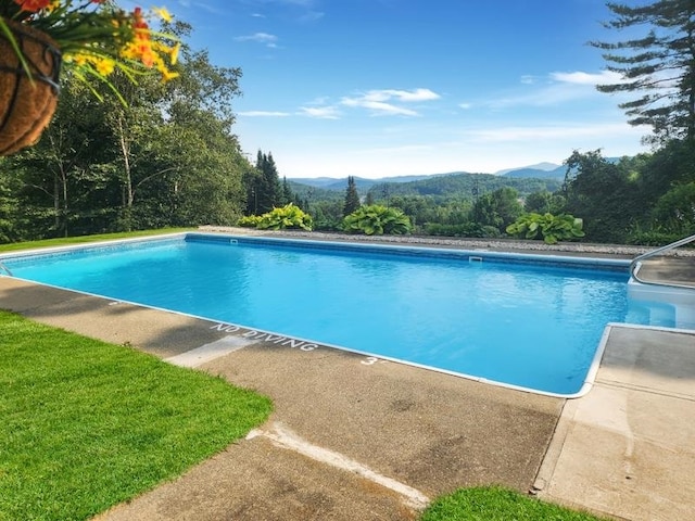 view of pool with a mountain view