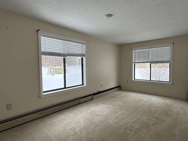 unfurnished room featuring baseboard heating, light carpet, and a textured ceiling