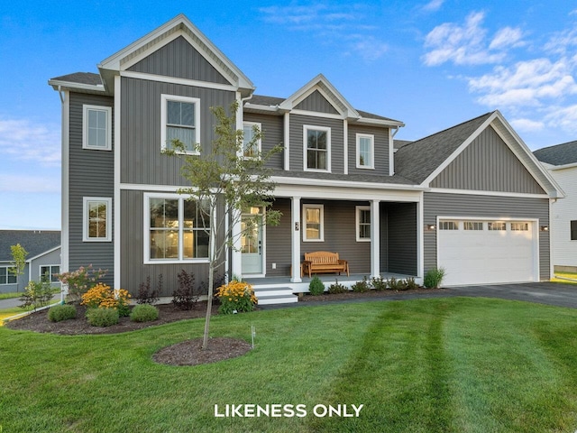 view of front of property featuring a garage, covered porch, and a front yard