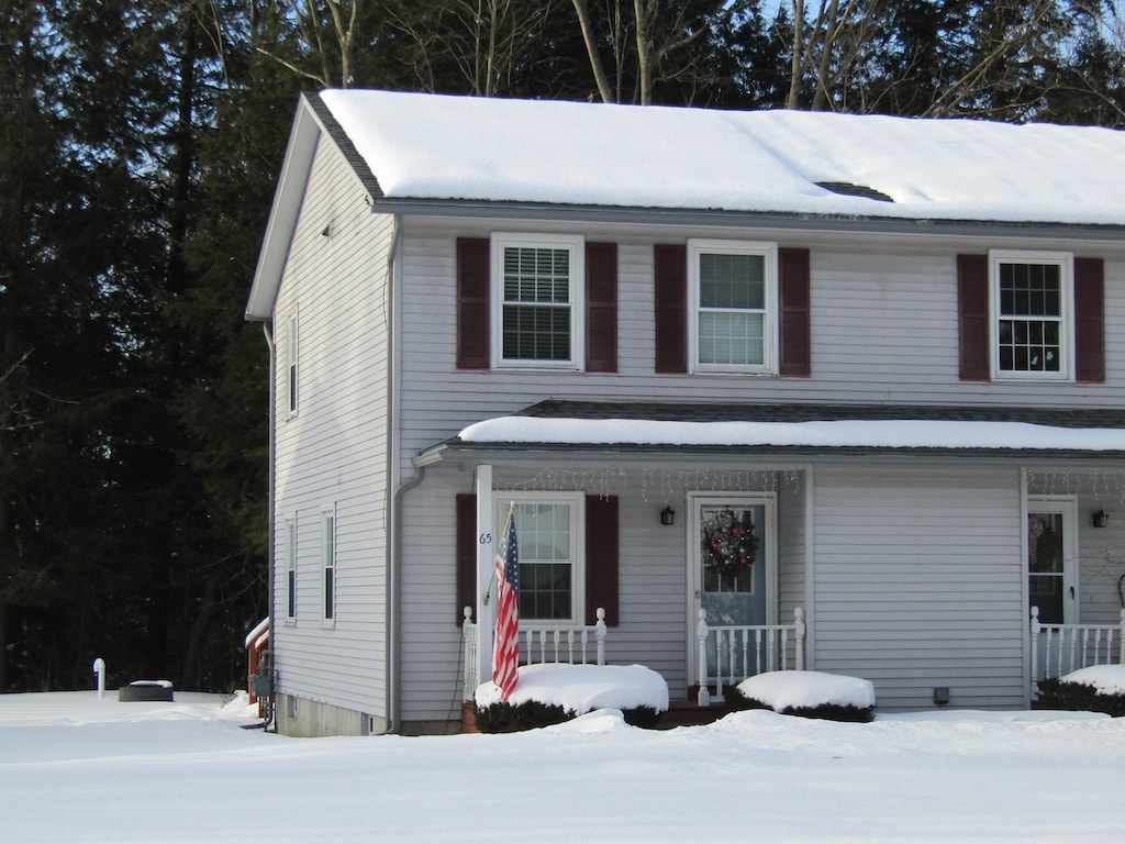 view of property featuring covered porch