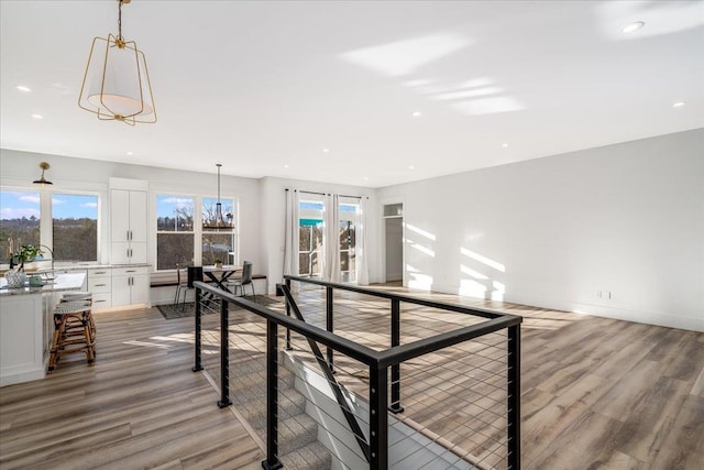 interior space featuring recessed lighting, baseboards, and light wood-type flooring