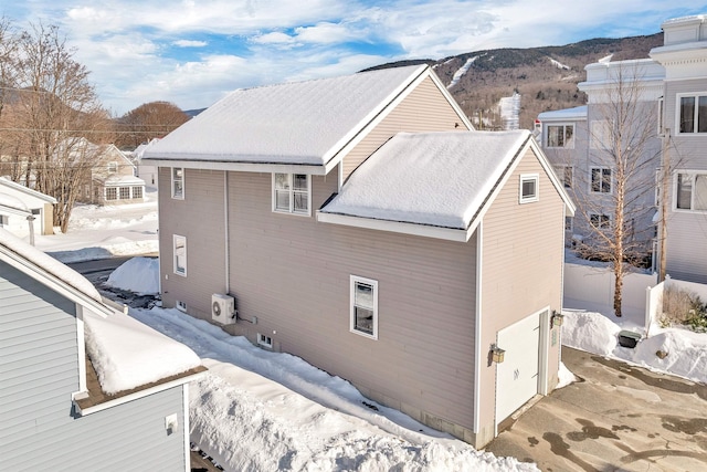 exterior space featuring a mountain view and a garage