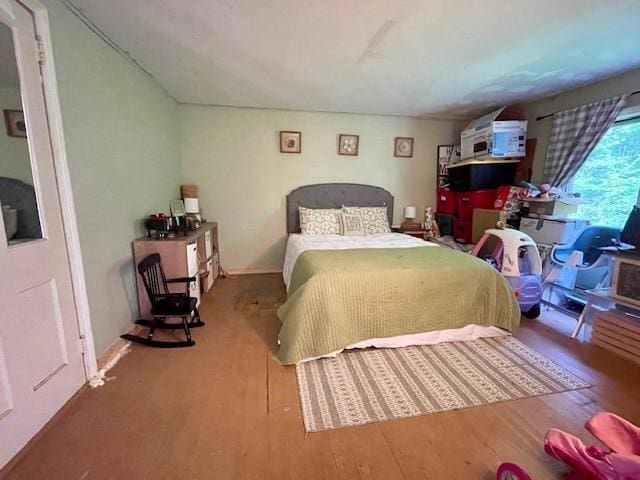 bedroom featuring wood-type flooring