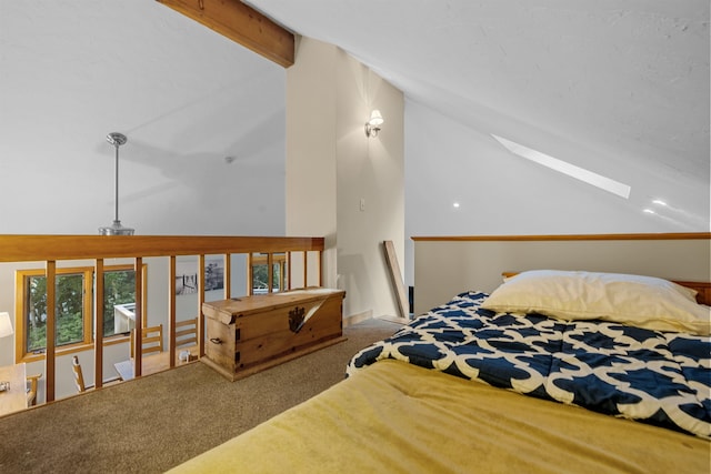 bedroom featuring vaulted ceiling with skylight and carpet floors