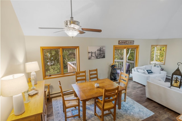 dining space featuring dark hardwood / wood-style flooring, a baseboard heating unit, and ceiling fan