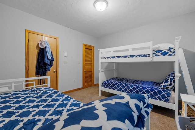 carpeted bedroom with a textured ceiling