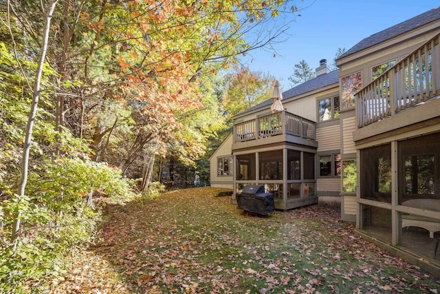 back of property featuring a sunroom