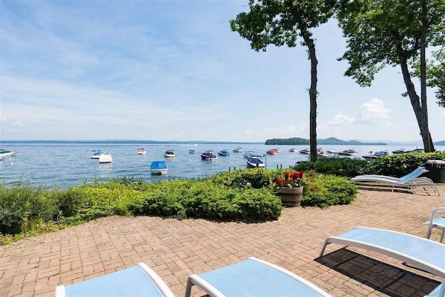 view of patio featuring a water view