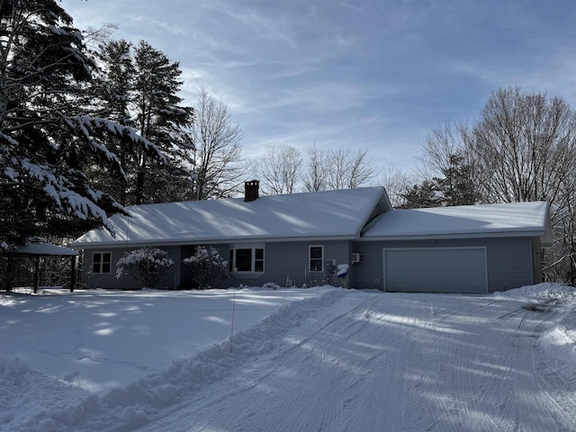 ranch-style house featuring a garage