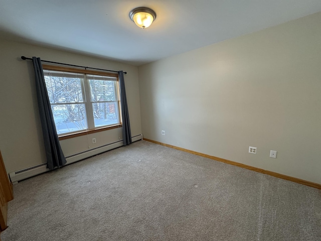 carpeted spare room with baseboard heating