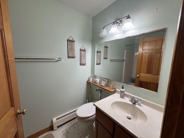 bathroom with vanity, baseboard heating, and toilet