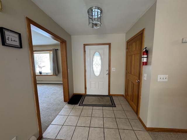 foyer entrance featuring light colored carpet and baseboard heating