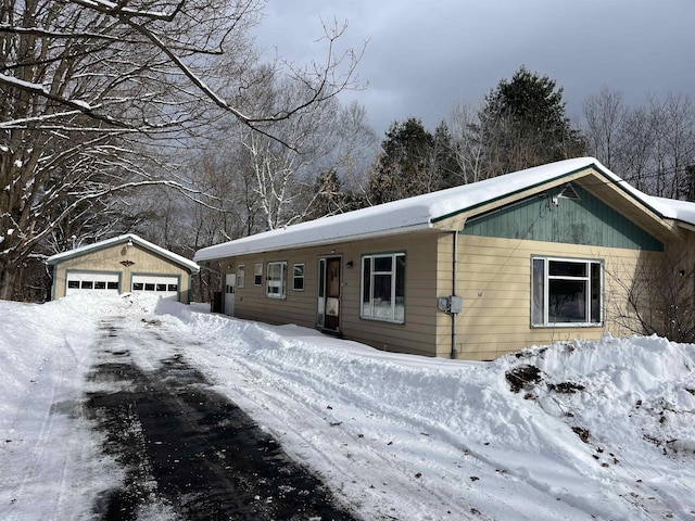 view of front of home with an outbuilding and a garage