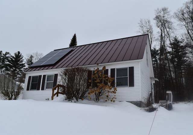 view of front of house with solar panels