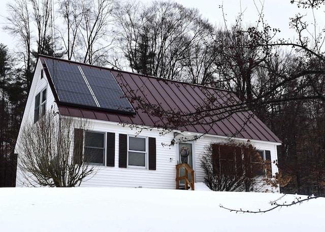 view of front of property with solar panels