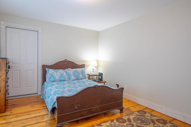 bedroom with light hardwood / wood-style floors