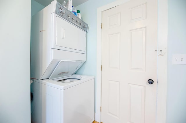 washroom with stacked washer / dryer