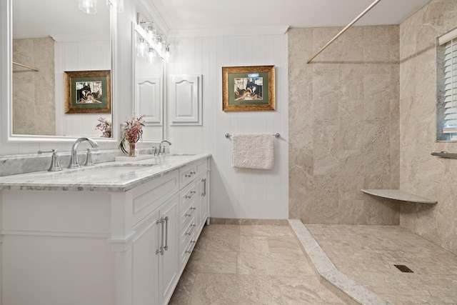 bathroom featuring crown molding and vanity