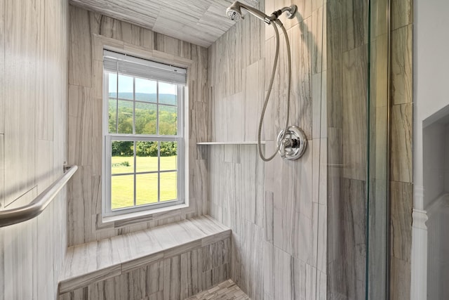 bathroom with a tile shower