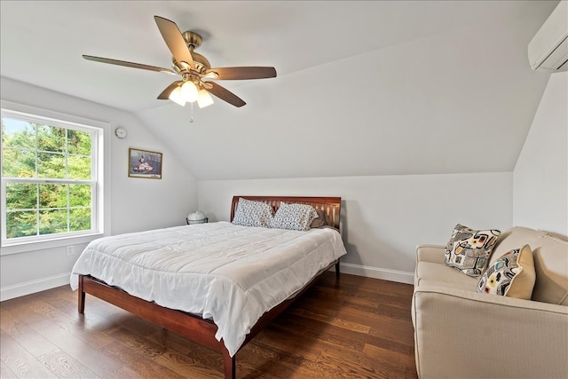 bedroom with vaulted ceiling, dark wood-type flooring, ceiling fan, and a wall unit AC