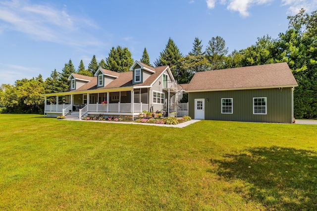 back of property featuring a yard and covered porch