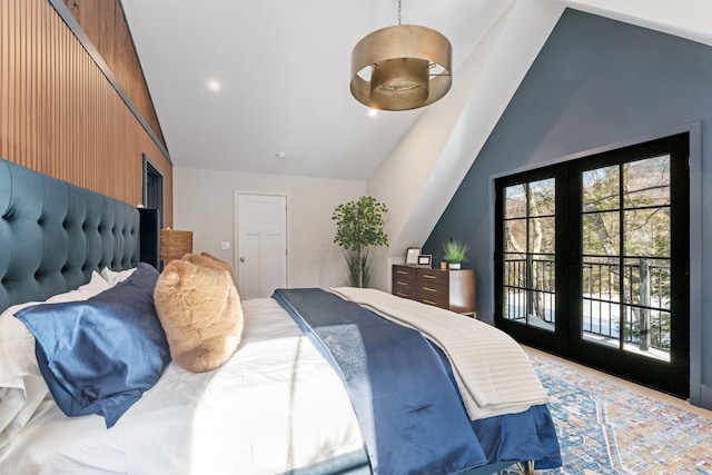 bedroom with lofted ceiling, multiple windows, access to outside, and french doors